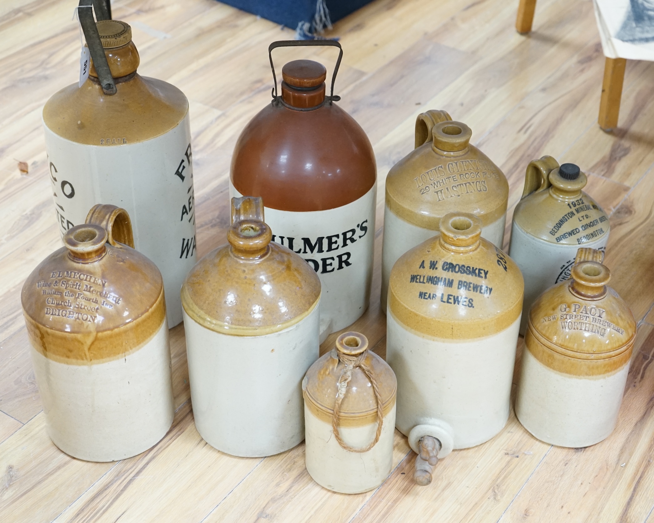 Nine various stoneware vessels including local brewers such as Lewes, Worthing, Hastings and Brighton. Condition - fair to good